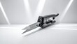 © shoukat - Electric scissors with metallic blade and ergonomic black handle on white surface, symbolizing precision cutting, modern design, and professional craftsmanship.