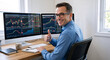 © Vyatcheslav - Smiling male stock trader giving thumbs up at desk. Happy financial broker working with computer monitors showing market charts. Successful investment and trading concept