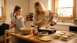 © ELENA - Mother pouring batter into skillet while daughter assists with cooking