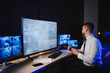 © Serhii - Security guard monitoring cctv surveillance system control room
