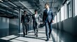 © MopoWe - Professional businessmen stride through a minimalist industrial office hallway with cinematic lighting and sharp focus. Ideal for corporate leadership and team recruitment marketing.