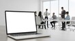 © Jafree - Blank laptop screen on office meeting table in modern corporate workspace. concept of business technology, professional environment, digital workspace, mockup, copy space
