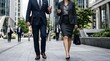 © Dave Dean - Business professionals walking down a city sidewalk in formal attire together