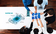 © InfiniteFlow - Diverse team collaborates over an electric vehicle blueprint, engaging in a puzzle activity that fosters creativity and innovative thinking around sustainable transport solutions. Trope