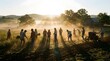 © Nurul - Group of volunteers working together in a rural farm field at sunrise.