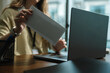 © Kornkanok - Businesswoman Reading Resignation Letter in Office