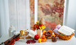 © Volodymyr - Autumn home vibes with mulled wine and candles. Autumn vibes with books. Fall atmosphere. Autumn fall leaves and warm tea. Autumn fall vibes with pastry and mulled wine.