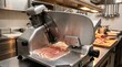 © StocksJust4You - Stainless steel meat slicer in commercial kitchen, thi meat slices resting beside blade, detailed food preparation scene, professional culinary equipment