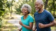© Iuliia - Senior woman and man jogging together in park. Active elderly couple running outside for cardiovascular health. Retirement lifestyle, fitness training and healthy aging concept.