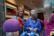 © Oscar - Mature women enjoying shopping for shoes together