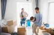 © Serhii - Family playing while moving into new home apartment