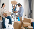 © Serhii - Happy family unpacking boxes in new house