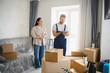 © Serhii - Woman discussing moving service with professional mover