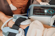 © Mdv Edwards - Male client undergoing a noninvasive muscle stimulation session targeting the buttocks area for body contouring and muscle toning.