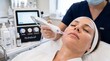 © Thipsuda - Woman receiving hydrafacial treatment at spa, close up of relaxed face, esthetician using modern skincare device, professional facial care, glowing skin, clean and healthy appearance