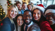 © Nan Shen - Diverse group of happy young business people or friends taking a selfie photo on smartphone during a christmas party in a modern office.