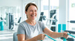 © Len_mik - Happy senior woman exercising with resistance bands in rehabilitation center for fitness blogs, health articles, motivational content, and wellness advertising