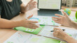 © ArLawKa - The business team is discussing ESG concepts and sustainability in the office.Professional colleagues are planning a green business strategy using ESG investment criteria.(Close-up view)