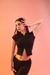 © New Africa - Young hip-hop dancer in stylish clothes posing on color background