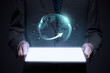 © Rawpixel.com - Businessman holding digital tablet with holographic globe projection