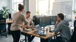 © StockVisionLab - Software developers working together on code at desk, debugging and programming computer software in bright startup office environment with whiteboard diagrams