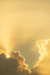 © Joshua Prasetyadi - Dramatic clouds at sunset. Thick, golden clouds illuminated by soft, warm sunlight.