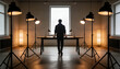 © Future Vision - Standing man at long table facing central window in loft studio, wearing dark clothes among lights