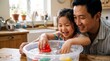 © Casee - Happy Asian Father Supporting Autistic Daughter in Sensory Water Play