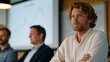 © forenna - Startup metrics review session with three department heads, wall projection showing north star metric trajectory, late afternoon warm office lighting, whiteboard beside screen covered in cohort brea