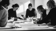 © Shankar - People working together at a table in a meeting room