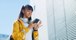 © peopleimages.com - Happy girl, phone and city with social media on space for connection, network or student research. Teenager, youth or user scrolling with smile on mobile smartphone for communication, app or chat