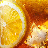 Close-up of lemon slice and ice cubes in iced tea