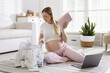 © New Africa - Pregnant woman packing bag for maternity hospital at home
