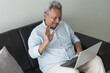 © Hector Pertuz - Senior man connecting with family during video call