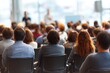 © Dina - public meeting. parent teacher conference. Rear view of group sitting in chairs at business presentation or workshop watching teacher lecture students. Education training concept, blurred background.