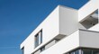 © Vibu design  gallery - Modern White Building Architecture Against Blue Sky