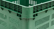 © Fafazi Studio - Close up of a green plastic crate isolated on a white background
