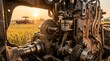 © TANONG SANGTONG - Internal mechanics of a thai tractor engine cross section in a rice field at sunset, agricultural machinery engineering.