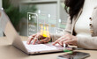 © Father_Studio - Businesswoman analyzing candidate recruitment data on laptop with virtual HR interface, representing employee screening, talent acquisition, digital hiring, and workforce management.