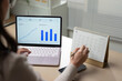 © Father_Studio - Businesswoman analyzing business data dashboard with calendar planning, operational indicators, strategic management, workflow organization, and corporate performance analysis.