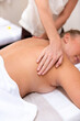 © Rawpixel.com - Person receiving a relaxing back massage in a spa setting.