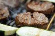 © 9parusnikov - Macro Shot of Vegan Burger Patties and Zucchini Slices on Grill