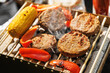 © 9parusnikov - High Angle Shot of Four Vegan Burgers on Portable BBQ