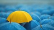 © arsya - Yellow umbrella standing out in crowd