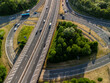 © di-photo - Aerial view of highway interchange with cars and trees