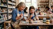 © Lucas - A grandmother and her granddaughter painting ceramic mugs together in a pottery studio