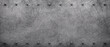 © DigitalPenTH - Dark grunge scratched metal texture background with iron rivets.