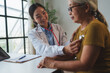 © crizzystudio - Doctor examining senior woman with stethoscope in clinic