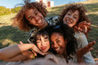 © bernardbodo - Diverse friends taking selfie smiling outdoors in park