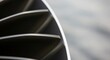 © Lee - Extreme close-up of a metallic turbine blade detail with sleek curved edges.